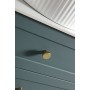 Knurled Round Handle - Brushed Brass in a bathroom setting