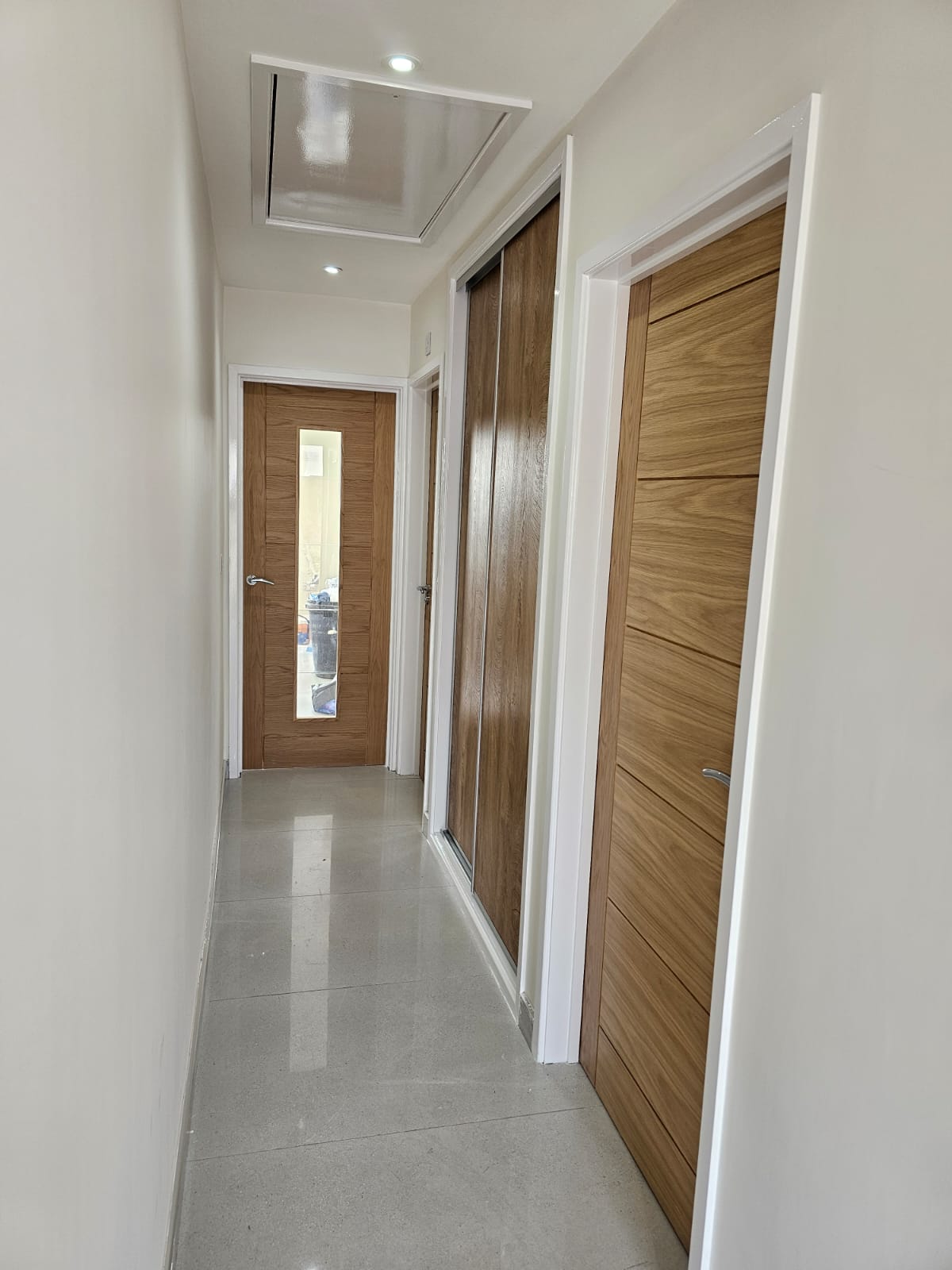Hallway floor tiles supplied and fitted by Laporsa